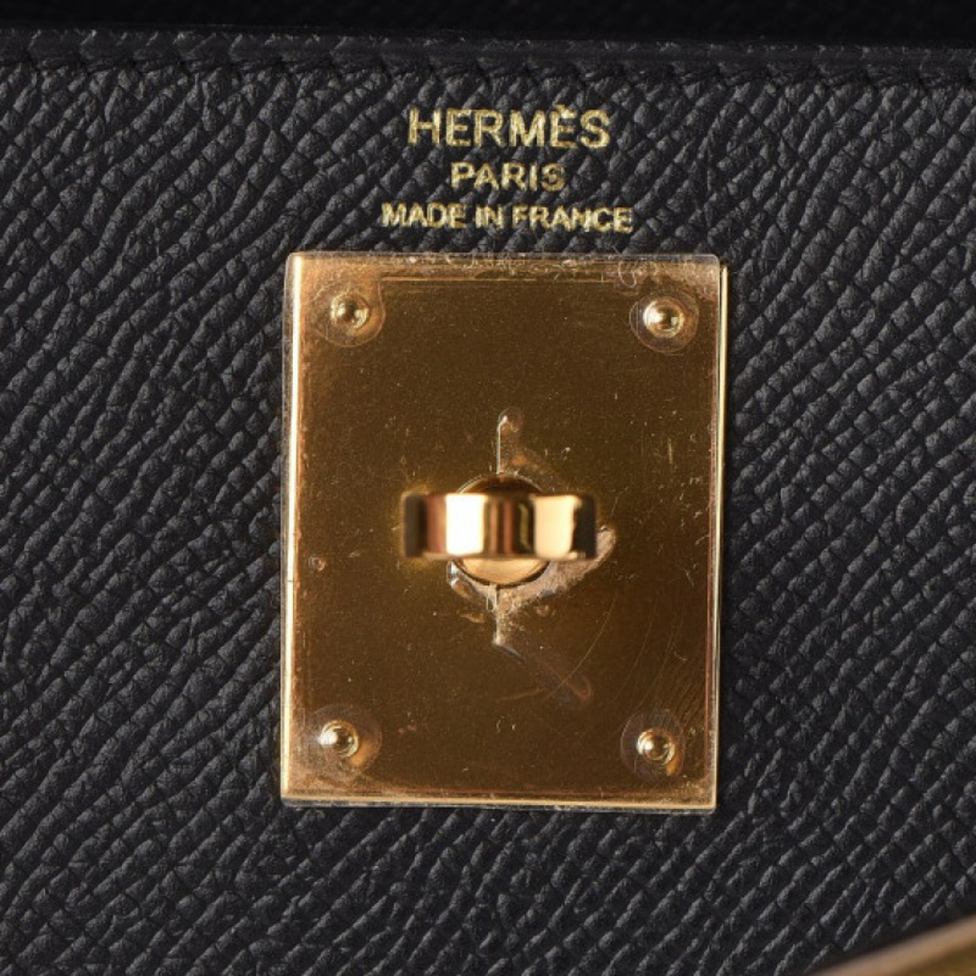 Hermès – Bolso Kelly 25 en negro con herrajes dorados
