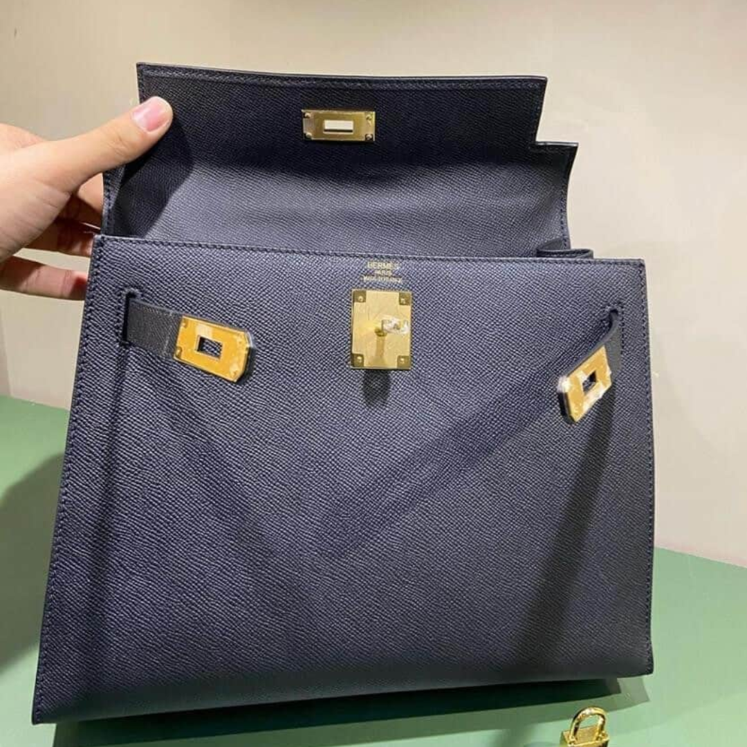 Hermès – Bolso Kelly 25 en negro con herrajes dorados